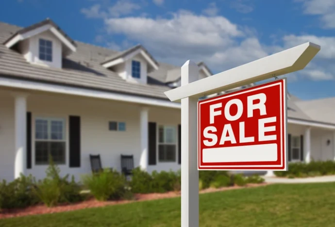 sold sign in front of home